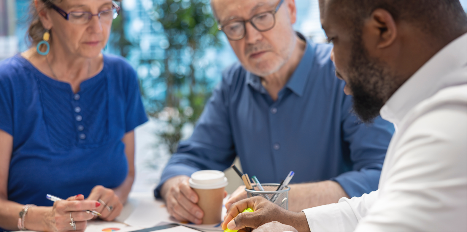 A couple planning for their retirement with an insurance broker.