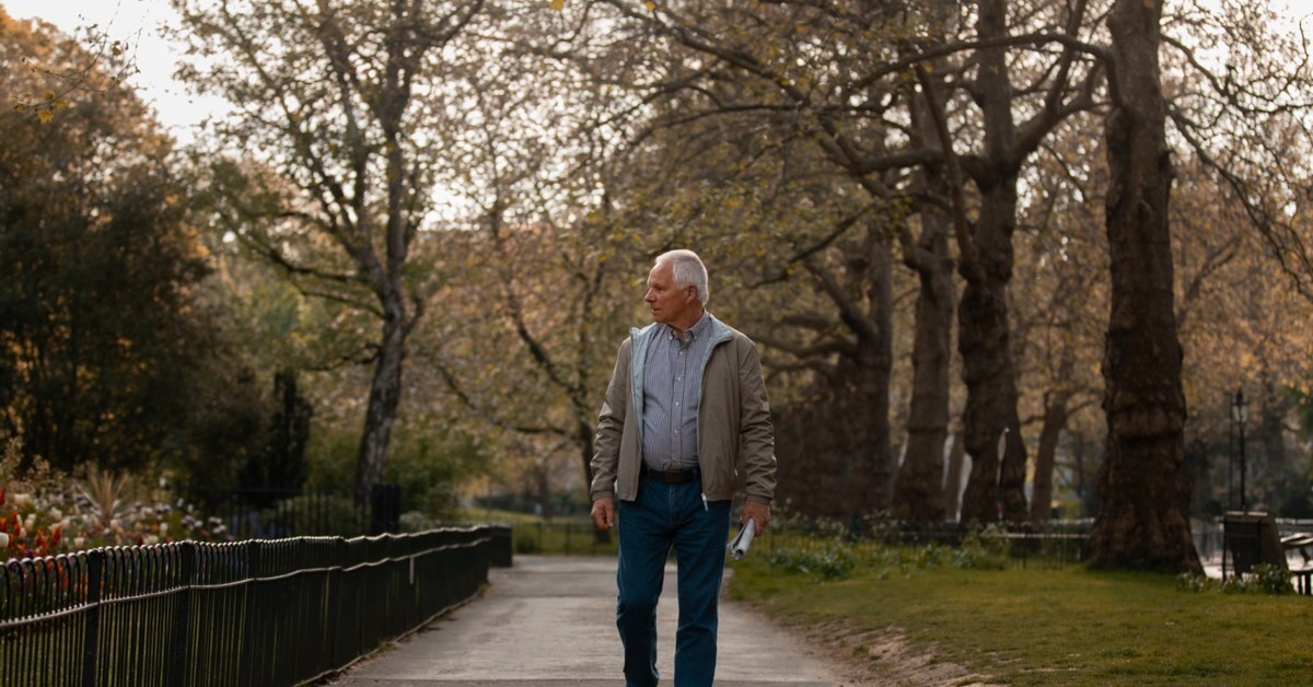 Man taking a walking on a fall day.